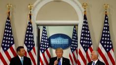 FILE PHOTO - U.S. President Donald Trump speaks at the first meeting of the Presidential Advisory Commission on Election Integrity co-chaired by Kansas Secretary of State Kris Kobach (L) and Vice President Mike Pence (R) at the White House in Washington,