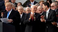 FILE PHOTO: U.S. President Donald Trump celebrates with Congressional Republicans after the U.S. Congress passed sweeping tax overhaul legislation, on the South Lawn of the White House in Washington, U.S., December 20, 2017. REUTERS/Carlos Barria/File Ph