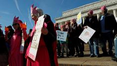 Codepink activist Paki Wieland, dressed as Lady Liberty, participates in the Second Annual Women's March in Washington, U.S. January 20, 2018. REUTERS/Leah Millis