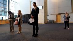 FILE PHOTO: Job seekers listen to a presentation at the Colorado Hospital Association job fair in Denver, Colorado, U.S., October 4, 2017. REUTERS/Rick Wilking/File Photo                  