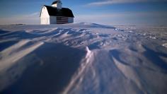 FILE PHOTO: A barn painted with the U.S. flag is seen in the snow covered field in Kanawha