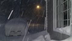 Heavy Lake Effect snow falls and accumulates on a vehicle in the driveway of a home in Orchard Park, New York, November 18, 2014. REUTERS/Judith Gros