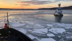 Coast Guard Cutter Penobscot Bay helps break free tug Stephanie Dann from the ice on the Hudson River near Kingston, New York, January 2, 2018. U.S. Coast Guard photo/Handout via REUTERS