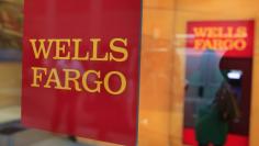 A Wells Fargo sign is seen outside a banking branch in New York July 13, 2012. REUTERS/Shannon Stapleton