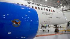 FILE PHOTO: Bombardier's CS300 Aircraft, showing its Pratt & Whitney engine in the foreground, sits in the hangar prior to its test flight in Mirabel February 27, 2015. REUTERS/Christinne Muschi/File Photo            