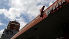 The corporate logo of the state oil company PDVSA is seen at a gas station in Caracas, Venezuela December 1, 2017. REUTERS/Marco Bello