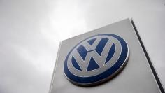 A VW sign is seen outside a Volkswagen dealership in London