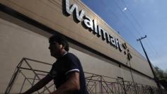 A person walks outside a Wal-Mart store in Mexico City January 11, 2013. REUTERS/Edgard Garrido