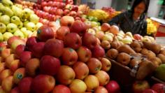 FILE PHOTO: A woman shops for produce inside a Whole Foods Market in the Manhattan borough of New York City