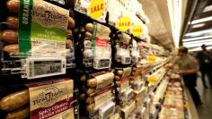 Prices of packaged sausages are displayed on digital price tags at a 365 by Whole Foods Market grocery store ahead of its opening day in Los Angeles, U.S., May 24, 2016. REUTERS/Mario Anzuoni 