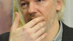 WikiLeaks founder Julian Assange gestures during a news conference at the Ecuadorian embassy in central London