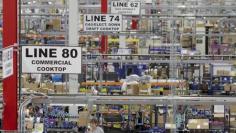 U.S. factories lose steam but private sector steps up hiring