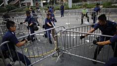 Hong Kong police use sledgehammers, chainsaws to clear protest barriers, open road