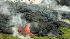 Molten lava from Hawaii volcano crosses onto residential property