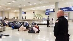 People gather to protest against the travel ban imposed by U.S. President Donald Trump's executive order, at Dallas/Fort Worth International Airport