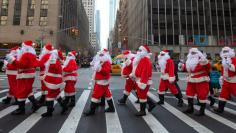 		<p>Some dozens of Santas ring their bells while marching through Midtown Manhattan during the Volunteers of America's 110th Annual Sidewalk Santa Parade in New York November 23, 2012. What has now become an annual tradition, over 50 fully-suited Volunte