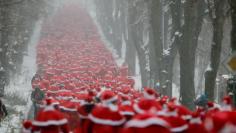 		<p>Runners dressed as Father Christmas take part in the so-called 'Nikolaus Run' in the East German town of Michendorf some 40km south-west of Berlin December 9, 2012. Around 800 participants took part in the Santa Claus running competition that is host