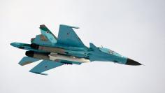 A Sukhoi SU-34 fighter-bomber with Russia's President Dmitry Medvedev on board is airborne over the Kubinka airbase outside Moscow