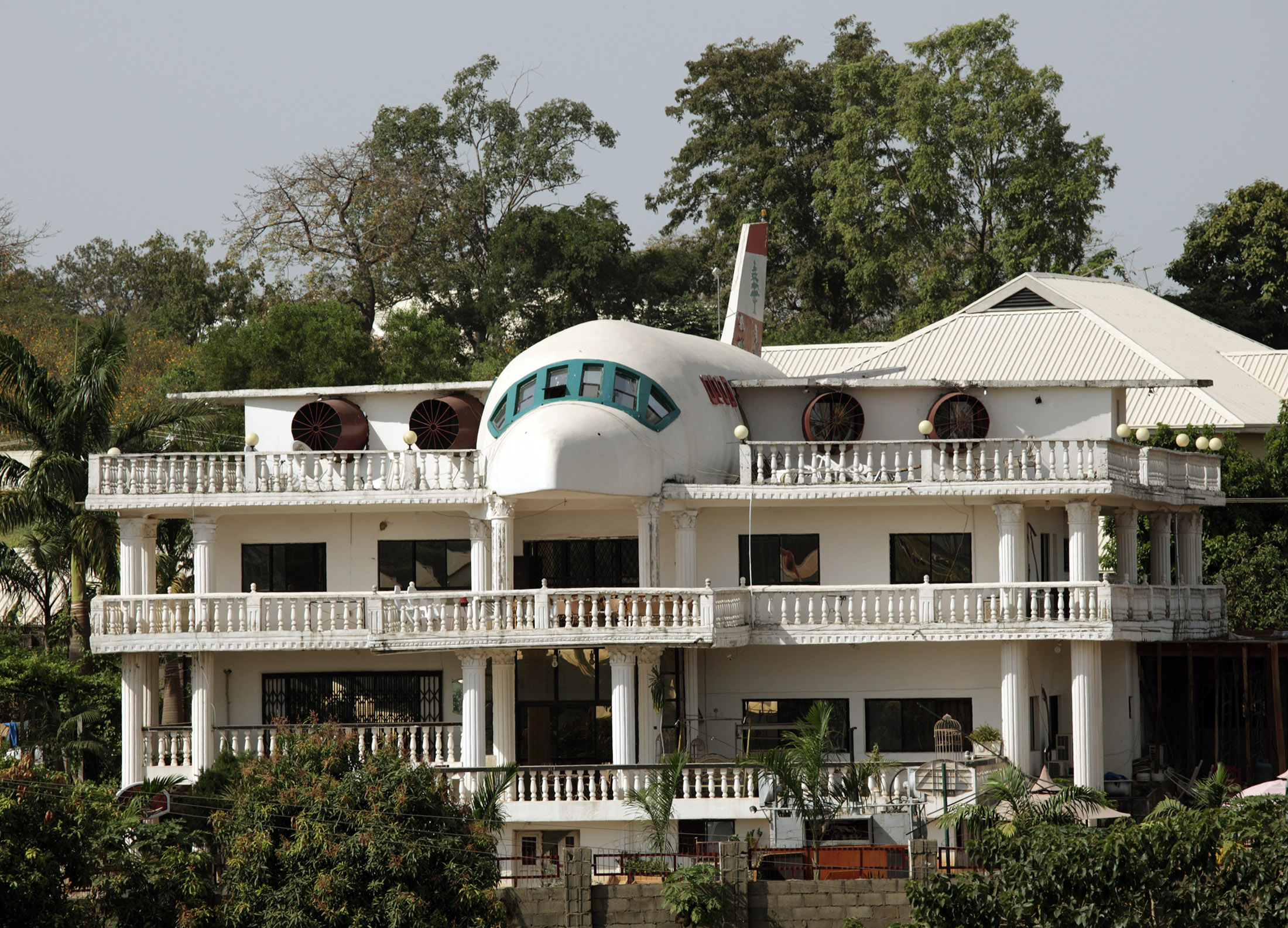 A house partially built in the shape of an airplane is seen in Abuja