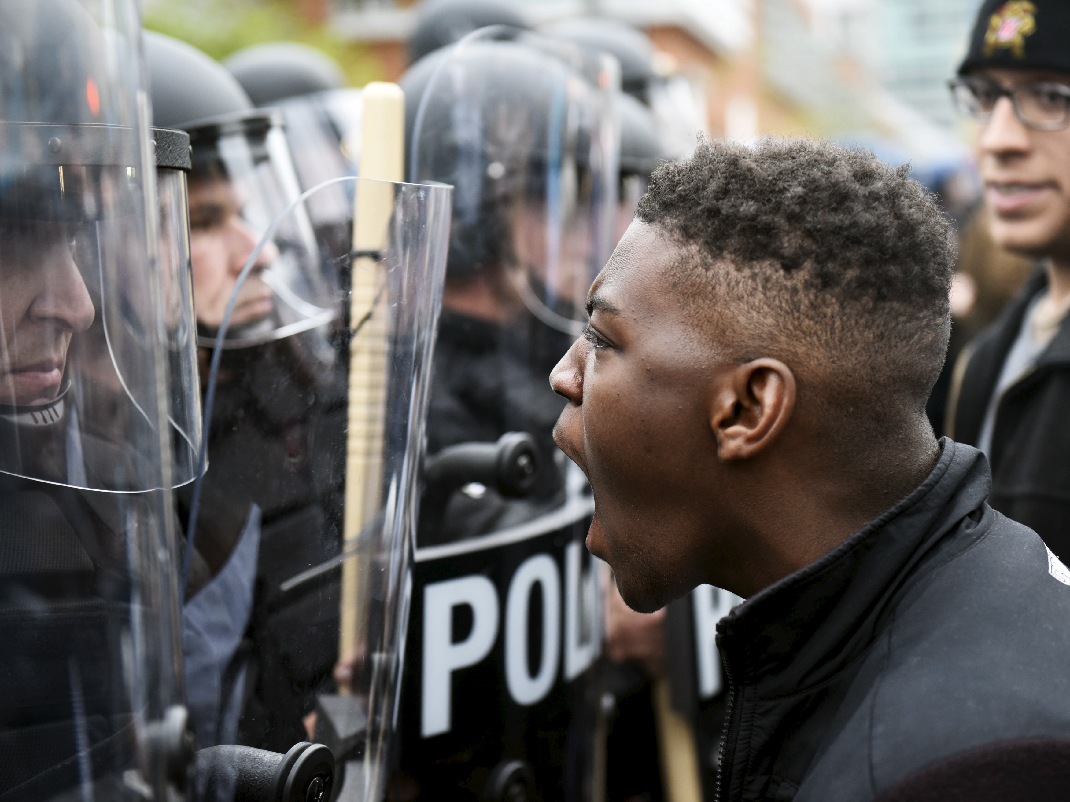 A demonstrator confronts police near Camden Yards during a protest against the death in police custody of Freddie Gray in Baltimore