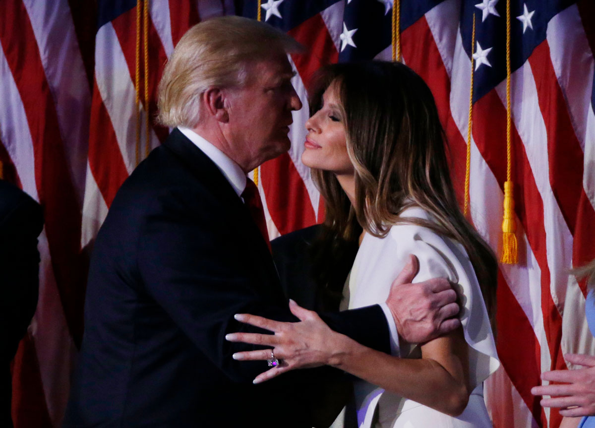 Republican U.S. President-elect Donald Trump kisses his wife Melania at his rally in New York