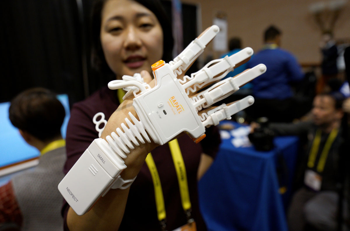 Anna Choi of Neofect demonstrates the Rapael Smart Glove therapy device for stroke victims at CES in Las Vegas