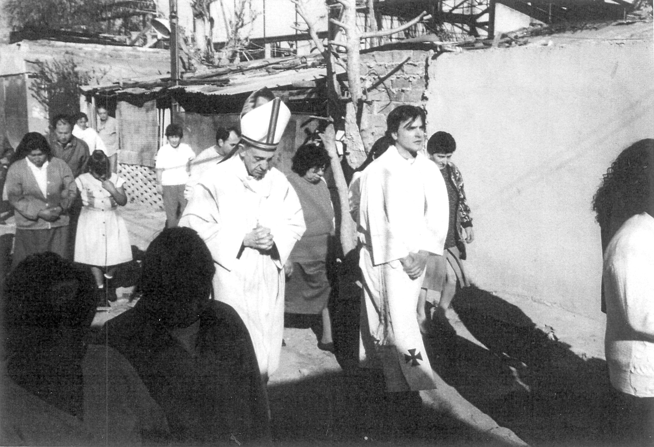 1998 photo of the then bishop Jorge Mario Bergoglio, now Pope Francis, accompanied by Father Jose Maria de Paola and local residents visiting the Villa 21-24 slum in Buenos Aires