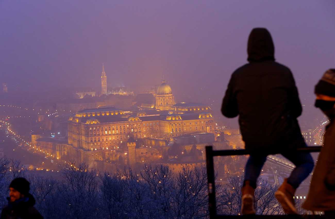 The Royal Castle is seen under a veil of heavy winter smog in Budapest
