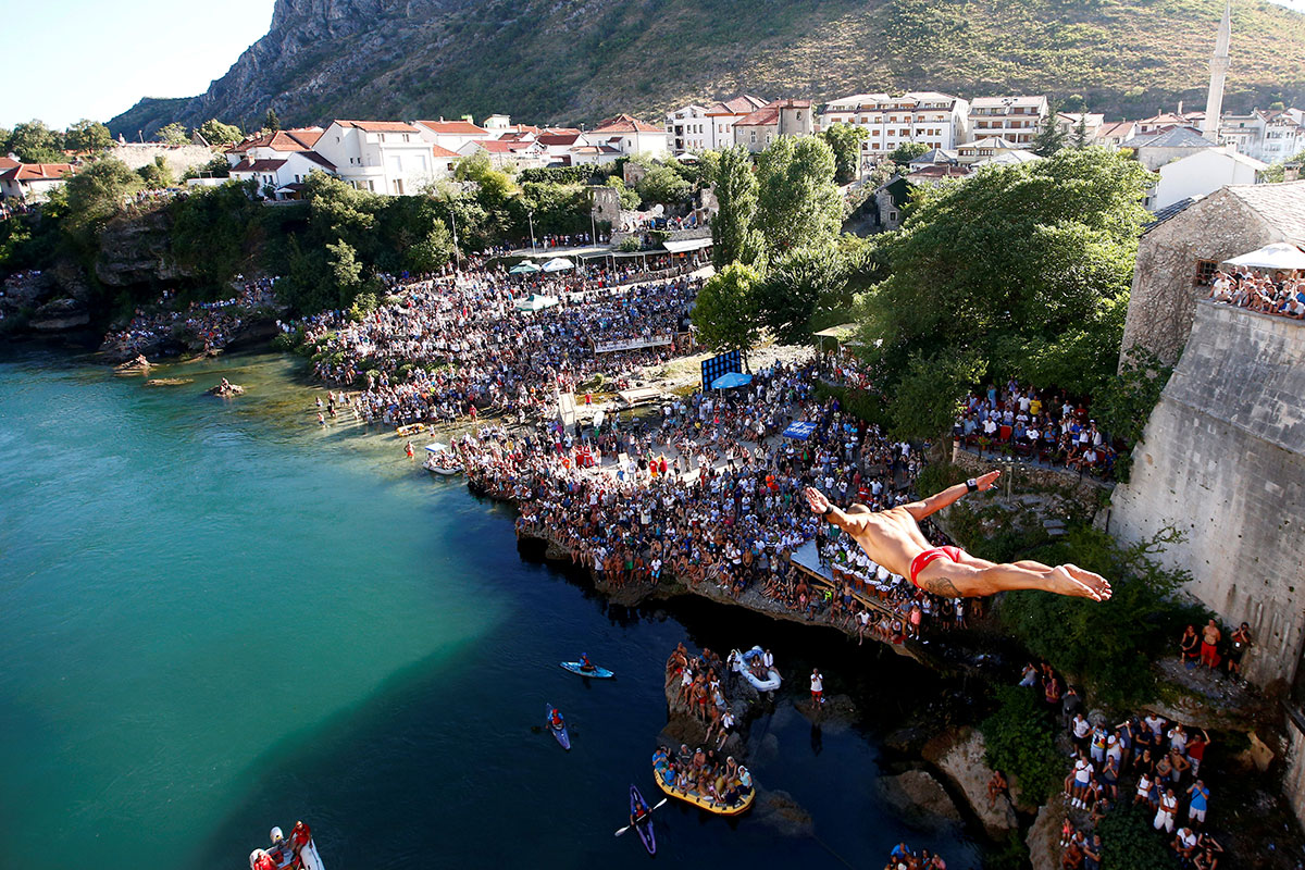 Lorens Listo jumps from the Old Bridge during the 451st traditional diving competition in Mostar