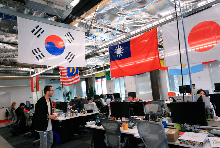 Employees work in the international user operations area. 