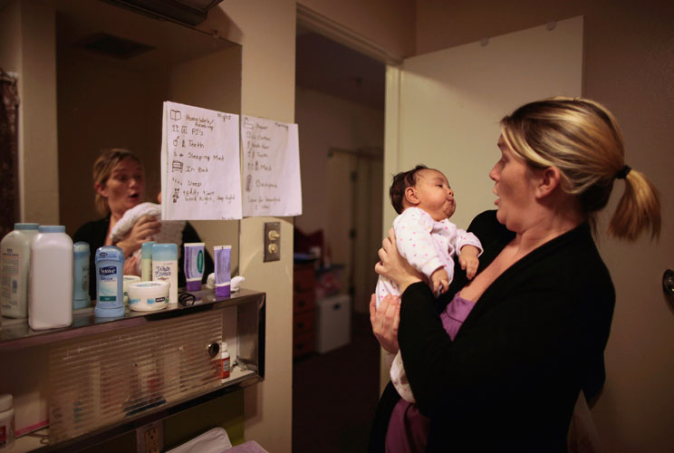 Doreen Earp, 38, of Germany looks at her five-week-old daughter Emily in their apartment at Hope Gardens Family Center, which is run by Union Rescue Mission on 77 acres of countryside near Los Angeles, California.         