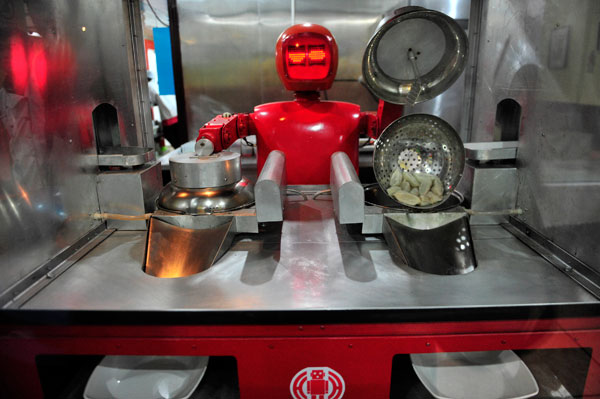 		<p>A robot that specialises in cooking, prepares "jiaozi", or Chinese dumplings, at the Robot Restaurant.</p>