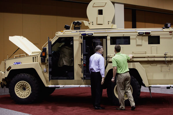 		<p>Attendees look at the Lenco MRAP Bear SWAT Team vehicle at the 7th annual Border Security Expo in Phoenix, Arizona March 12, 2013. Products and services from over 100 companies are on display, showing the latest technology in security products and dr