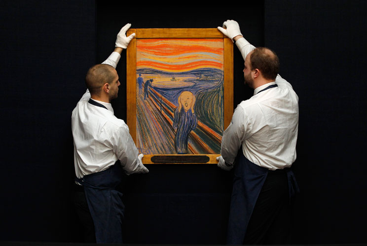Sotheby&#039;s employees pose with Edvard Munch&#039;s &quot;The Scream&quot; at the auction house in London, April 12, 2012. The painting, estimated to exceed $80 million (50.2 million pounds), broke a world record in New York on May 2, 2012, becoming the most expensive pai
