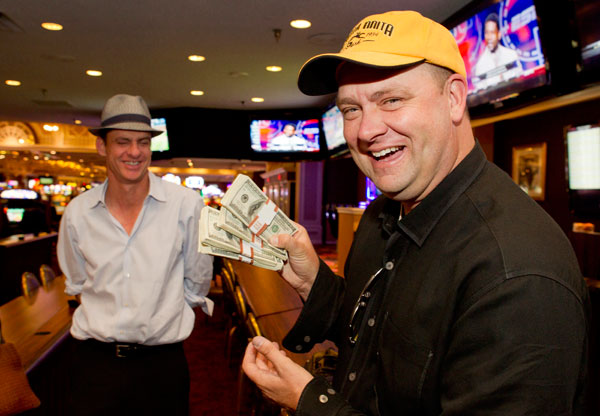 		<p>Doug O'Neill, trainer of Kentucky Derby winner "I'll Have Another", displays his winnings after cashing a 200-to-1 future bet on the horse at the Primm Valley Casino in Primm, Nevada June 25, 2012. O'Neill won $20,000 for his $100 bet, which he made 