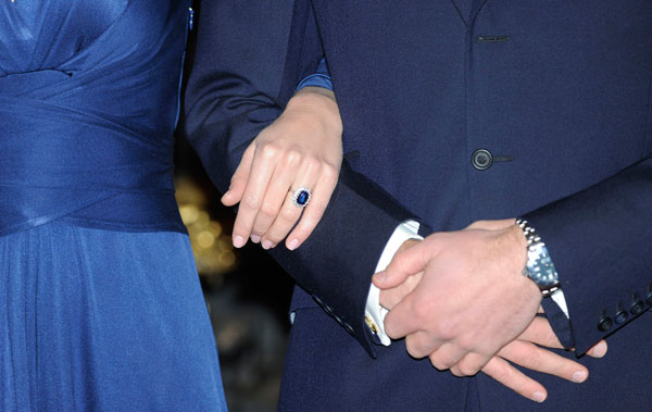 		<p>Kate holds the arm of her new fiance, as they pose for a photograph in St. James's Palace, central London November 16, 2010. Britain's The engagement followed an on-off courtship lasting nearly a decade, bringing months of speculation about his inten