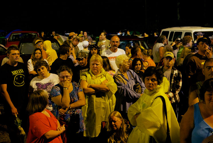 People wait to receive a wristband number for medical treatment at the Remote Area Medical (RAM) clinic in Wise, Virginia on July 20, 2012. RAM clinics bring free medical, dental and vision care to uninsured and under-insured people across the country and