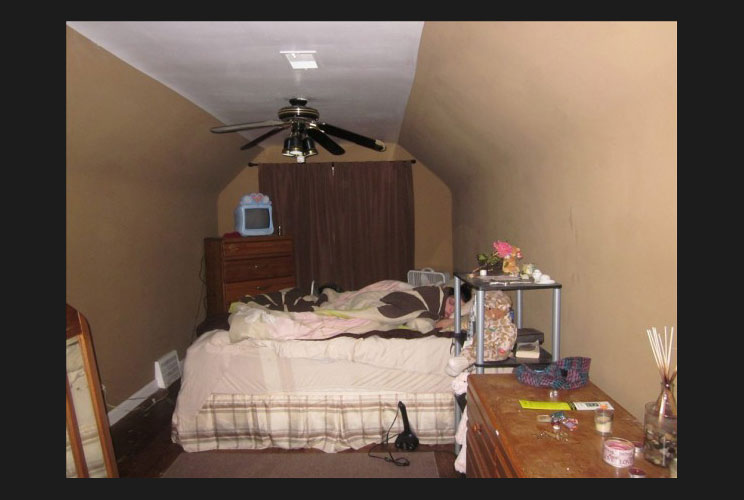 We all know that the housing market is sluggish, but apparently homeowners are, too. A listing for a three-bedroom, two-bath short-sale in Dearborn, Michigan, includes a photo of a woman sleeping in a cluttered bedroom.  No wonder she wants to close her e