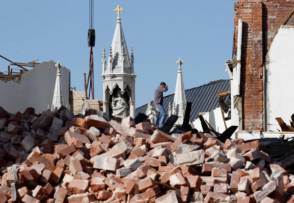 		<p>A man takes part in the clean up of St. Joseph's Catholic Church which was destroyed by a tornado in Ridgway, Illinois, March 1, 2012. Powerful storms that spawned tornadoes ripped through the U.S. Midwest on Wednesday, killing at least 12 people, in