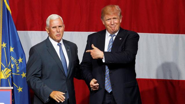 Republican U.S. presidential candidate Donald Trump points to Indiana Governor Mike Pence before addressing the crowd during a campaign stop at the Grand Park Events Center in Westfield