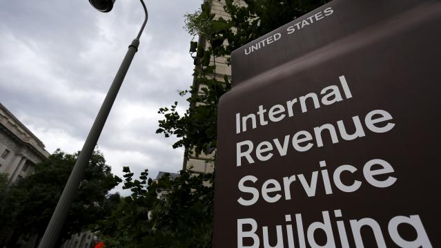 A security camera hangs near a corner of the Internal Revenue Service (IRS) building in Washington