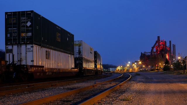 At dusk, railroad cars wait on the tracks next to the blast furnaces of the now-closed Bethlehem Steel mill in Bethlehem