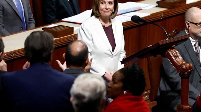 Pelosi takes in the applause from her colleagues.