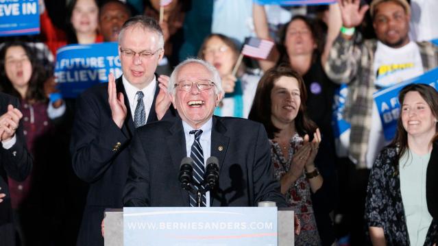Democratic U.S. presidential candidate Bernie Sanders smiles after winning at his 2016 New Hampshire presidential primary night rally in Concord