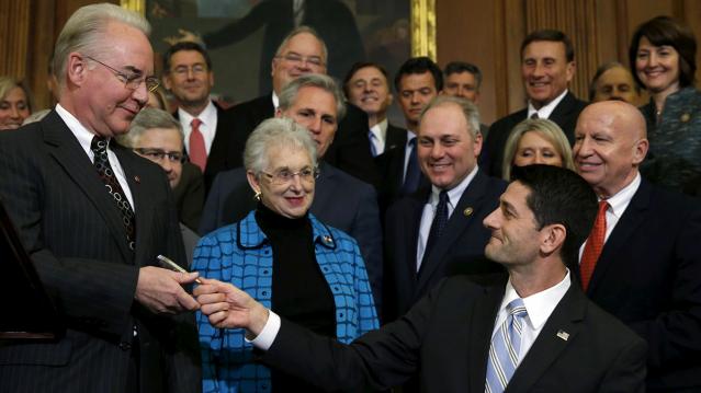 Ryan hands the pen to Price after signing a bill repealing Obamacare at the U.S. Capitol in Washington