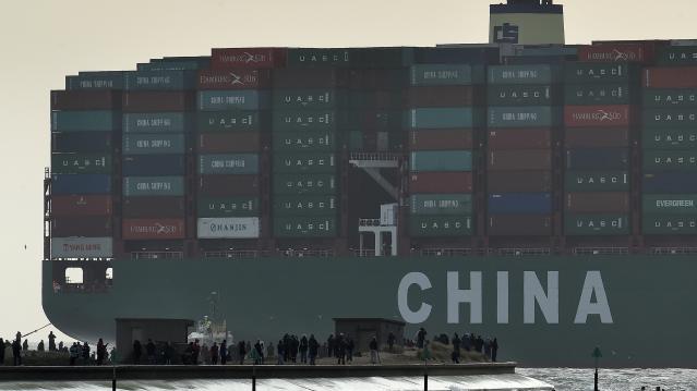 Onlookers watch as the largest container ship in world, CSCL Globe, docks during its maiden voyage, at the port of Felixstowe in south east England