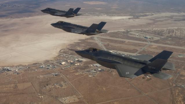 FILE PHOTO: Three F-35 Joint Strike Fighters flies over Edwards Air Force Base