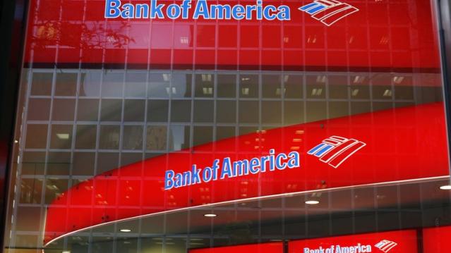 Reflections are seen in the windows of a Bank of America branch in New York