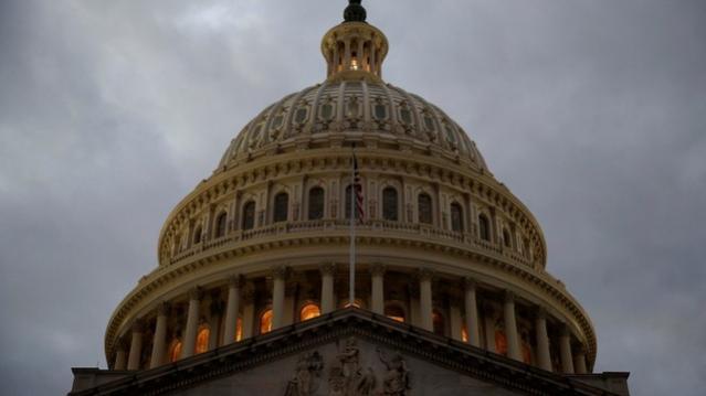 The U.S. Capitol building is lit at dusk ahead of planned votes on tax reform in Washington, U.S., December 18, 2017.   REUTERS/Joshua Roberts/Files