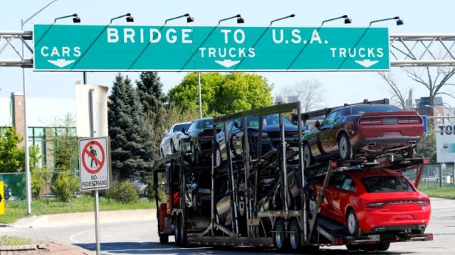 FILE PHOTO - A car hauler heading for Detroit, Michigan, drives on the lane to Ambassador Bridge in Windsor, Ontario, Canada on April 28, 2017. REUTERS/Rebecca Cook/File Photo